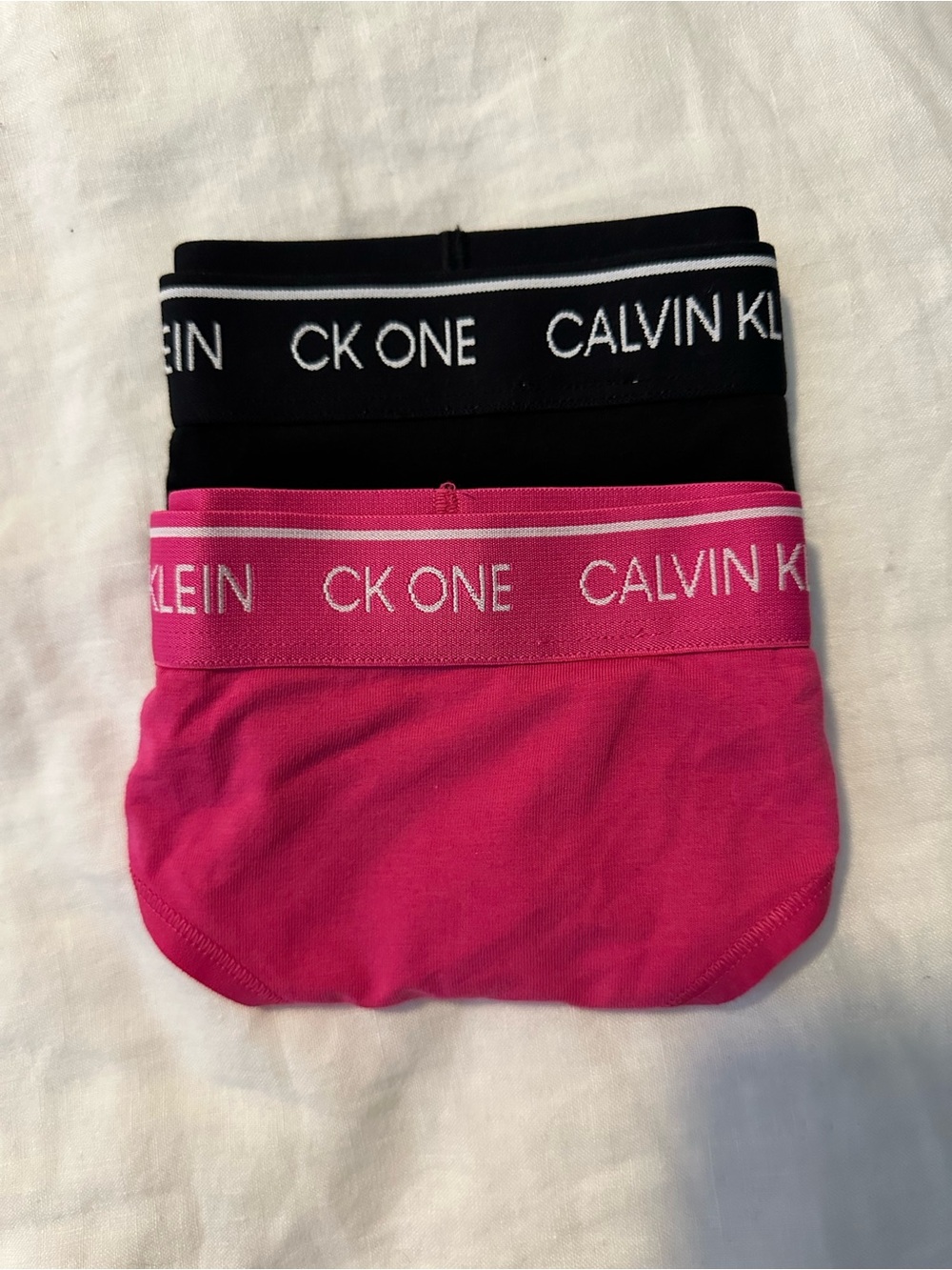 Calvin Klein Women’s CK One Thong 2-Pack in Black & Hot Pink